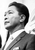 Ferdinand Emmanuel Edralin Marcos (September 11, 1917 – September 28, 1989) was 10th President of the Philippines from 1965 to 1986. He was a lawyer, member of the Philippine House of Representatives (1949–1959) and a member of the Philippine Senate (1959–1965). He was Senate President from 1963-1965. In 1983, his government was implicated in the assassination of his primary political opponent, Benigno Aquino, Jr. The implication caused a chain of events, including a tainted presidential election that served as the catalyst for the People Power Revolution in February 1986 that led to his removal from power and eventual exile in Hawaii.