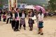 Thailand: A group of men and women share a joke, Hmong New Year celebrations, Chiang Mai, Northern Thailand