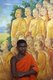 Sri Lanka: A monk stands in front of a mural in the Temple of the Tooth, Kandy