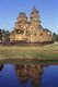 Prasat Sikhoraphum is a Khmer Hindu temple built in the 12th century by King Suryavarman II (r. 1113 - 1150).<br/><br/>

Prasat Sikhoraphum dates from the early 12th century and has been beautifully restored. It consists of five brick prangs on a square laterite platform surrounded by lily-filled ponds. The lintel and pillars of the central prang are beautifully carved with heavenly dancing girls, or apsara, and other scenes from Hindu mythology. 